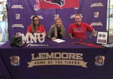 Lemoore High varsity softball standout Megan Van Allen accepts an offer to play college softball at MidAmerica Nazarene University in Kansas. She signed with parents Melody and Jeff Van Allen.